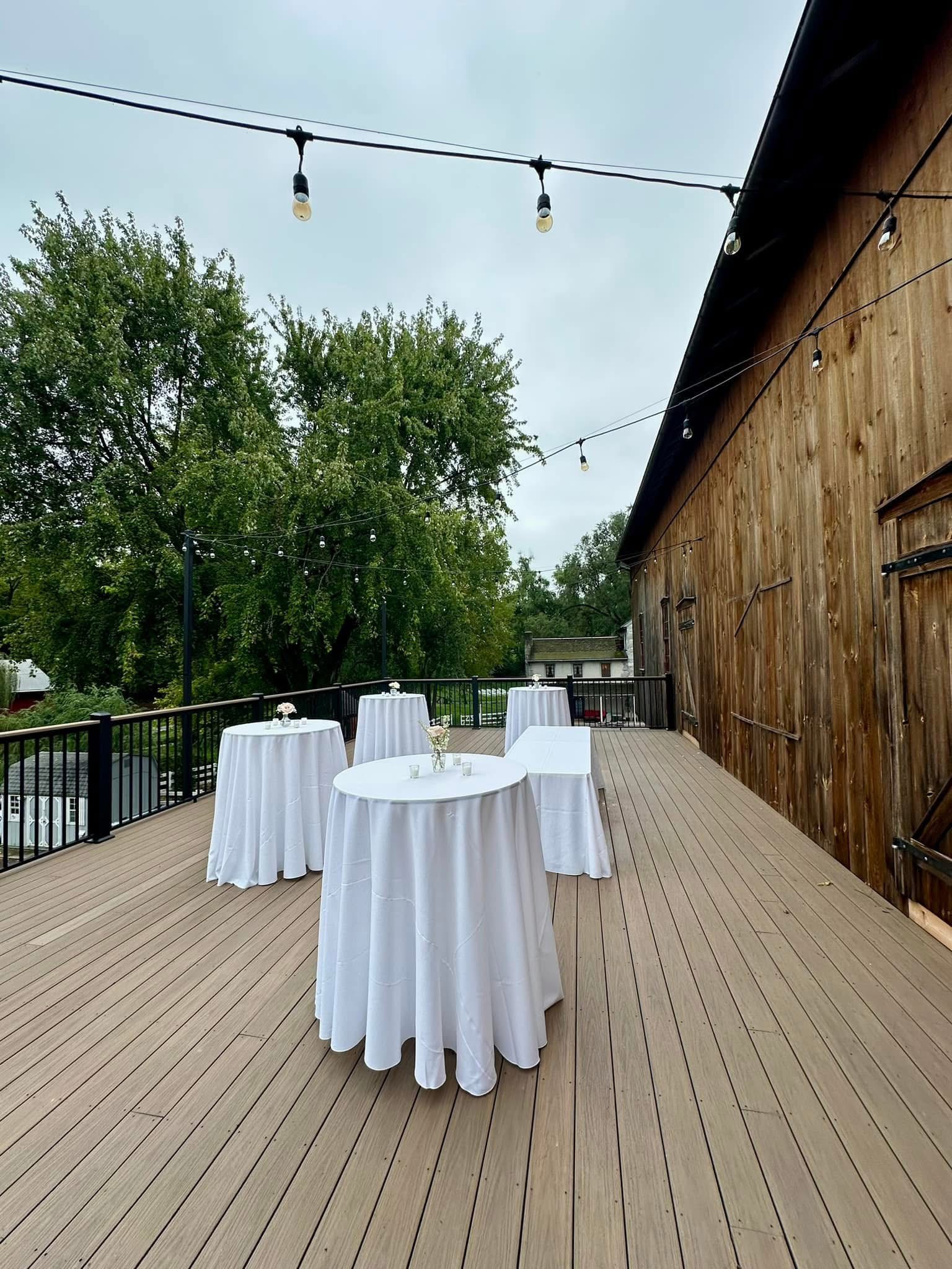 Outdoor deck wedding celebration at Shawnee Run's barn venue